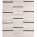 Handwoven white and brown wool-blend flatweave rug with a modern geometric striped pattern.