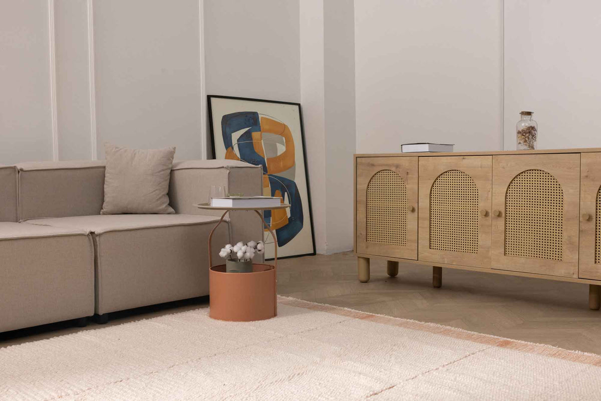 Apricot shaggy wool rug with a soft high-pile texture in a cozy, modern living room setting.
