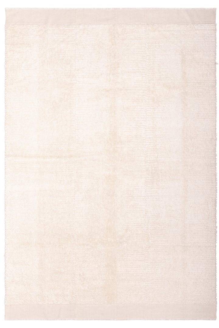 Beige rug with a subtle pattern on a white background