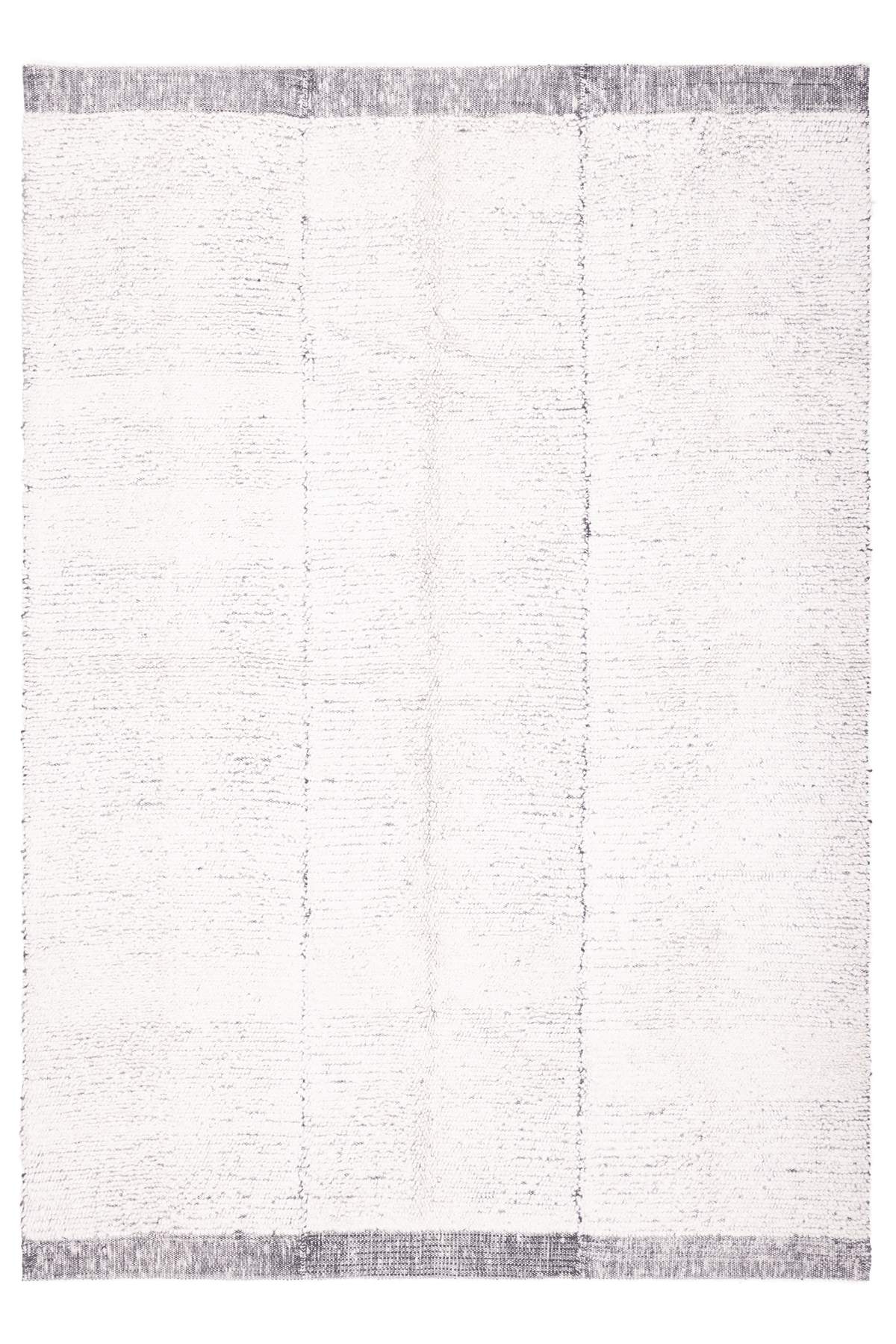 Handwoven black and white shaggy wool rug with a thick, textured pile and decorative border detailing.
