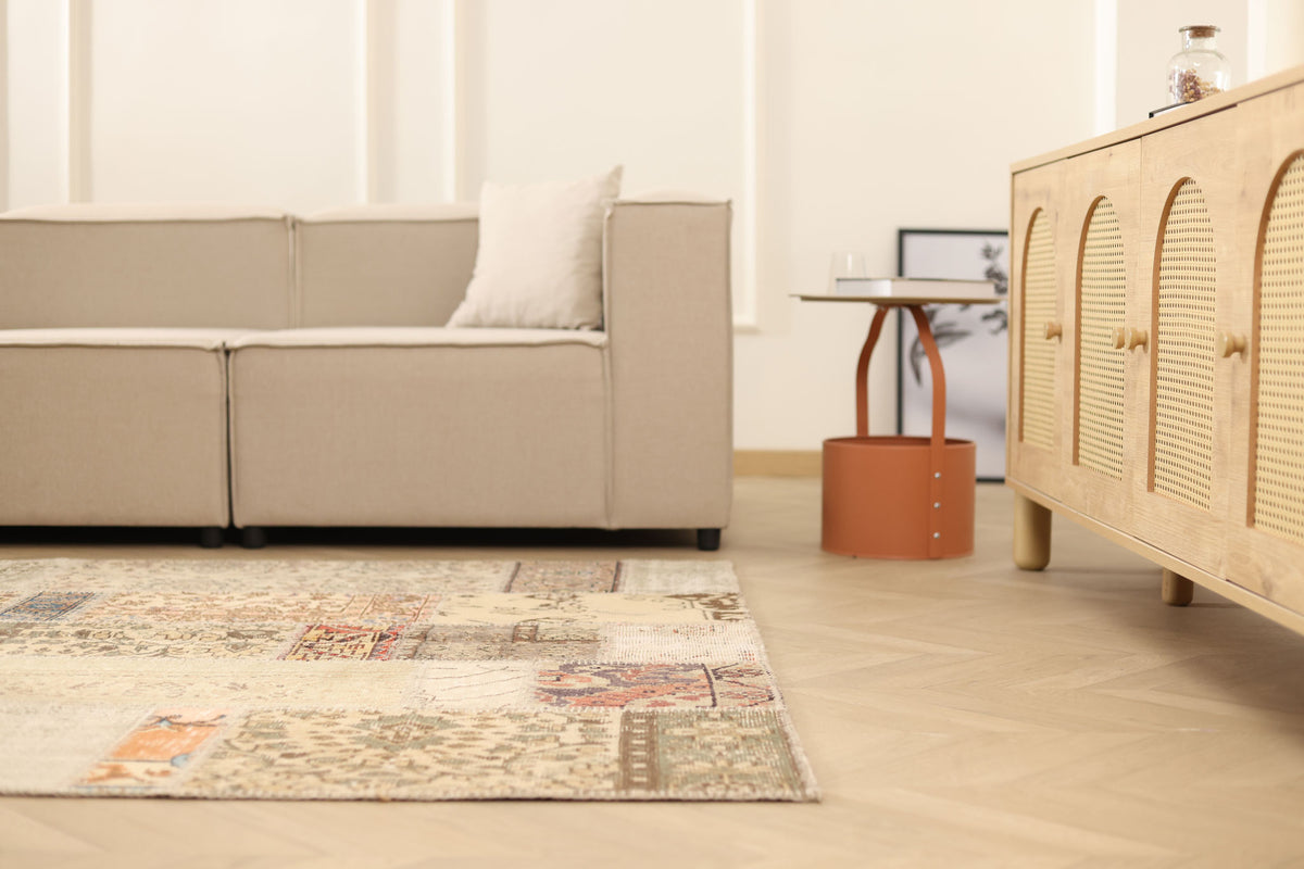 5x7 ft vintage Turkish patchwork area rug in wool and cotton with colorful floral patterns in a modern living room.