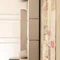 Handmade 5x7 ft vintage Turkish patchwork rug with floral patterns and mixed colors in a modern living room setting.