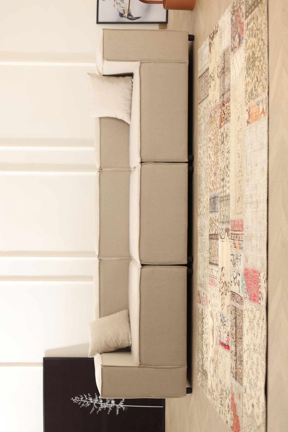 Handmade 5x7 ft vintage Turkish patchwork rug with floral patterns and mixed colors in a modern living room setting.