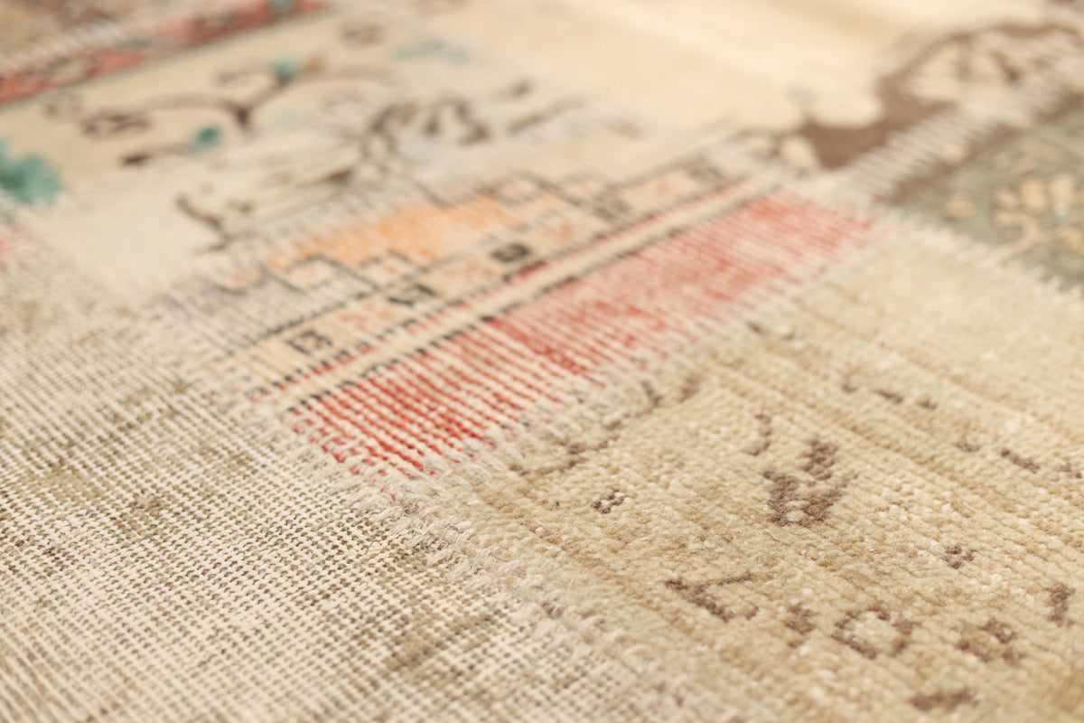 Handmade 5x7 patchwork Turkish rug in wool and cotton with vintage floral patterns and a vibrant, eclectic color mix.