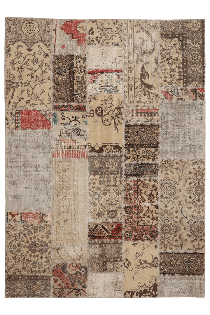 Handmade 5x7 patchwork Turkish area rug featuring vintage floral patterns in a mix of wool and cotton with earthy tones.