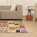 5x8 ft vintage Turkish patchwork area rug featuring vibrant, hand-stitched floral wool and cotton pieces in a bohemian style.