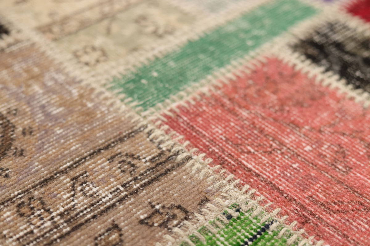 Handmade 5x8 ft vintage Turkish patchwork rug featuring colorful floral patterns in wool and cotton.