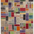 5x8 ft handmade Turkish patchwork area rug featuring vibrant, multicolored floral patterns in wool and cotton.