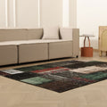 5x7 ft black patchwork vintage Turkish rug with distressed wool and cotton patterns in a modern living room.