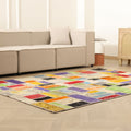 Handmade 5x8 ft vintage patchwork area rug featuring vibrant, multi-colored floral patterns in wool and cotton.