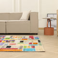 5x8 ft vintage Turkish patchwork area rug with vibrant, multi-colored floral wool and cotton patterns in a bohemian room.