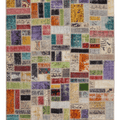 Handmade 5x8 ft patchwork Turkish area rug featuring vibrant, multi-colored vintage wool and cotton floral patterns.