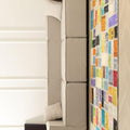 5x7 ft vintage Turkish patchwork area rug with vibrant floral patterns in wool and cotton, styled in a modern living room.