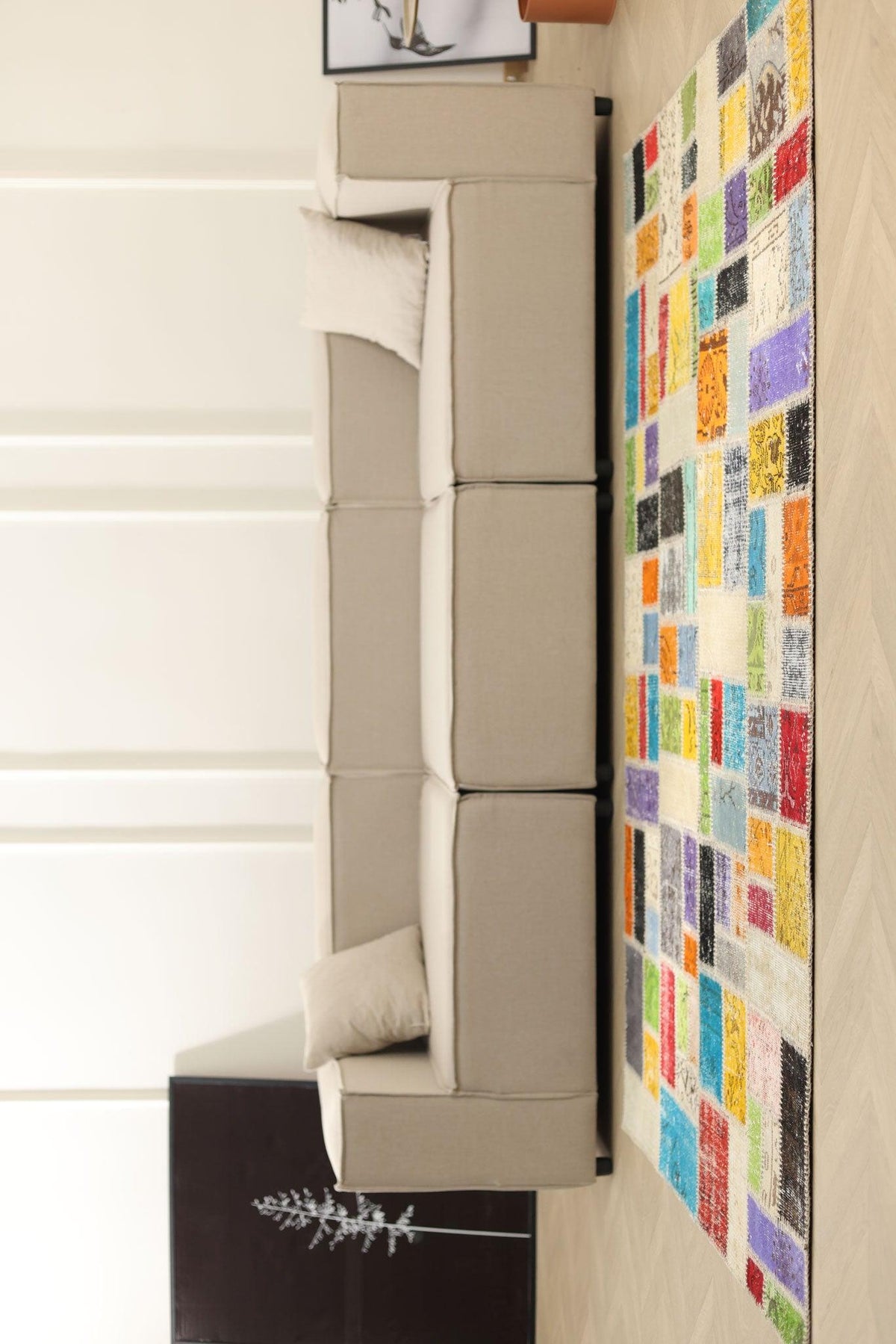 5x7 ft vintage Turkish patchwork area rug with vibrant floral patterns in wool and cotton, styled in a modern living room.