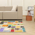 5x7 ft handmade Turkish patchwork area rug with vibrant, multicolored floral patterns in wool and cotton.