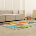 5x7 ft handmade Turkish patchwork area rug in vibrant floral patterns, crafted from wool and cotton in a bohemian style.
