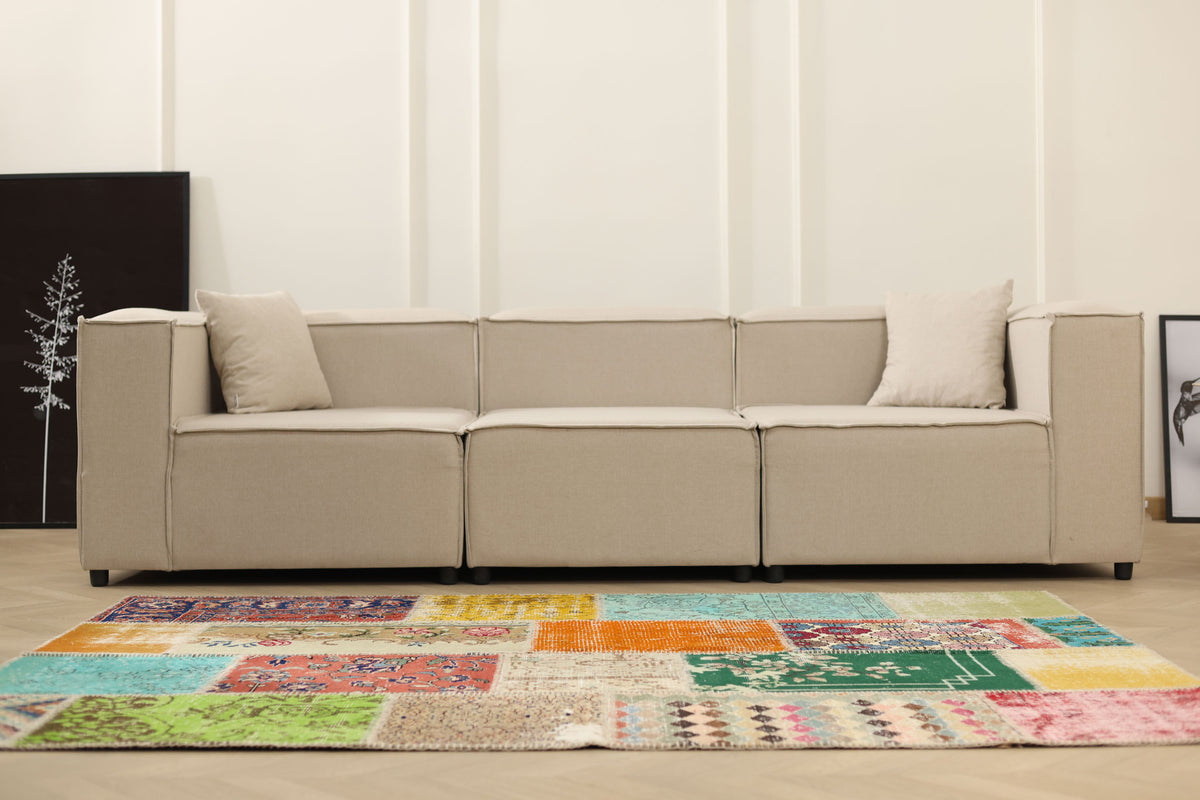 Handmade 5x7 ft vintage Turkish patchwork area rug featuring vibrant floral patterns in wool and cotton.