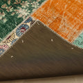 Handmade 5x7 patchwork Turkish rug featuring vibrant floral wool and cotton panels with a durable stitched backing.