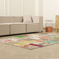 5x7 ft vintage Turkish patchwork area rug with vibrant floral patterns in wool and cotton, styled in a modern living room.