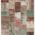 Handmade 5x7 ft vintage Turkish patchwork area rug featuring a vibrant mix of floral patterns in wool and cotton.