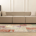 Handmade 5x7 ft patchwork Turkish area rug with vibrant floral patterns in wool and cotton, styled in a modern living room.