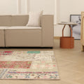 Handmade 5x7 ft vintage Turkish patchwork area rug with vibrant floral patterns in wool and cotton on a wooden floor.