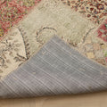 Handmade 5x7 ft patchwork Turkish rug with vibrant floral patterns, wool and cotton blend, showing the stitched fabric backing.