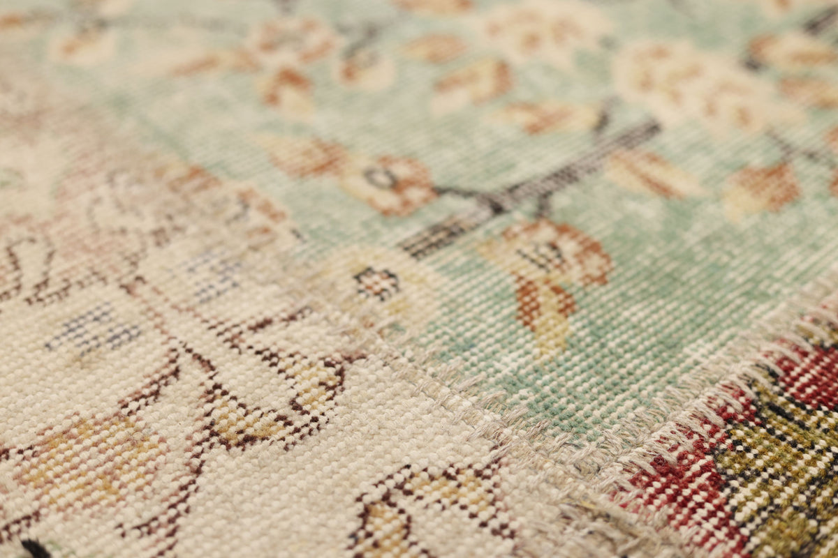 Handmade 5x7 patchwork Turkish rug with floral patterns in wool and cotton, featuring a vibrant, multi-colored vintage design.