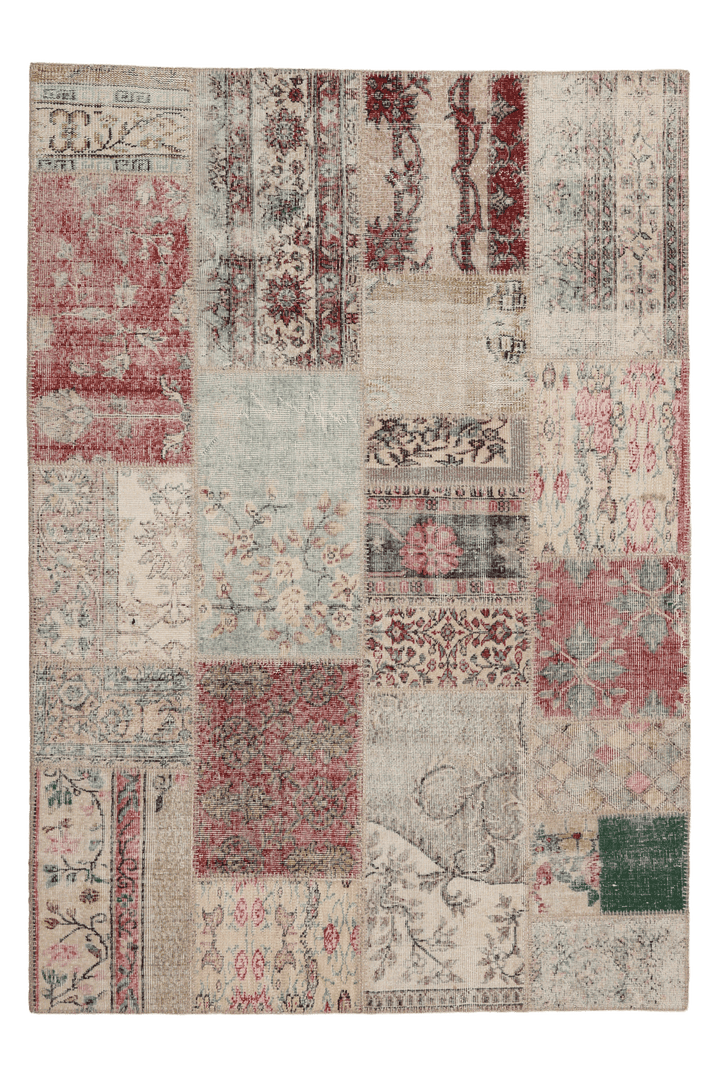 Handmade 5x7 ft patchwork Turkish area rug featuring vintage floral patterns in a mix of wool and cotton.