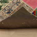 Handmade 5x7 ft vintage Turkish patchwork area rug featuring vibrant geometric wool and cotton patterns.