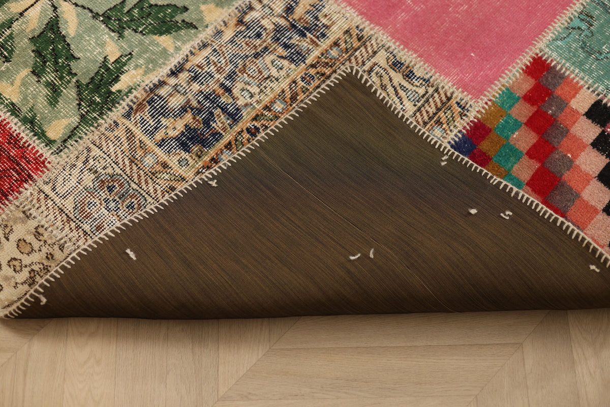 Handmade 5x7 ft vintage Turkish patchwork area rug featuring vibrant geometric wool and cotton patterns.
