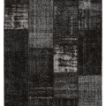 5x7 ft black patchwork area rug made from hand-stitched vintage wool and cotton with a distressed, overdyed bohemian design.