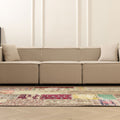 5x7 ft handmade Turkish patchwork area rug in wool and cotton with vibrant floral patterns in a bohemian living room.