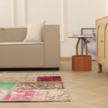 5x7 ft vintage patchwork Turkish area rug in wool and cotton with vibrant floral patterns in a bohemian living room.