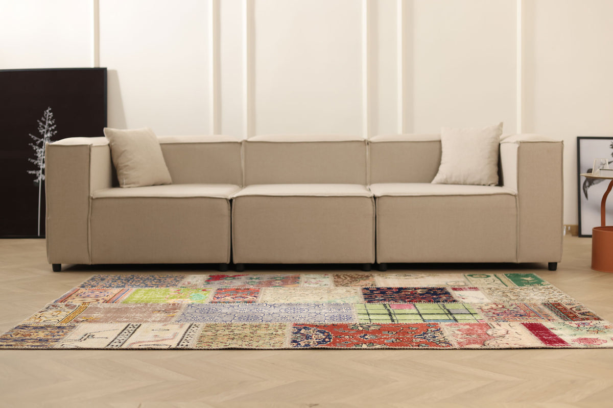 5x7 ft vintage Turkish patchwork area rug with vibrant floral patterns, hand-stitched wool and cotton in a bohemian style.