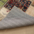 Handmade 5x7 ft vintage Turkish patchwork rug featuring colorful floral patterns and a durable fabric backing.