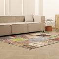 5x7 ft handmade Turkish patchwork area rug featuring vibrant floral patterns in wool and cotton on a light wood floor.