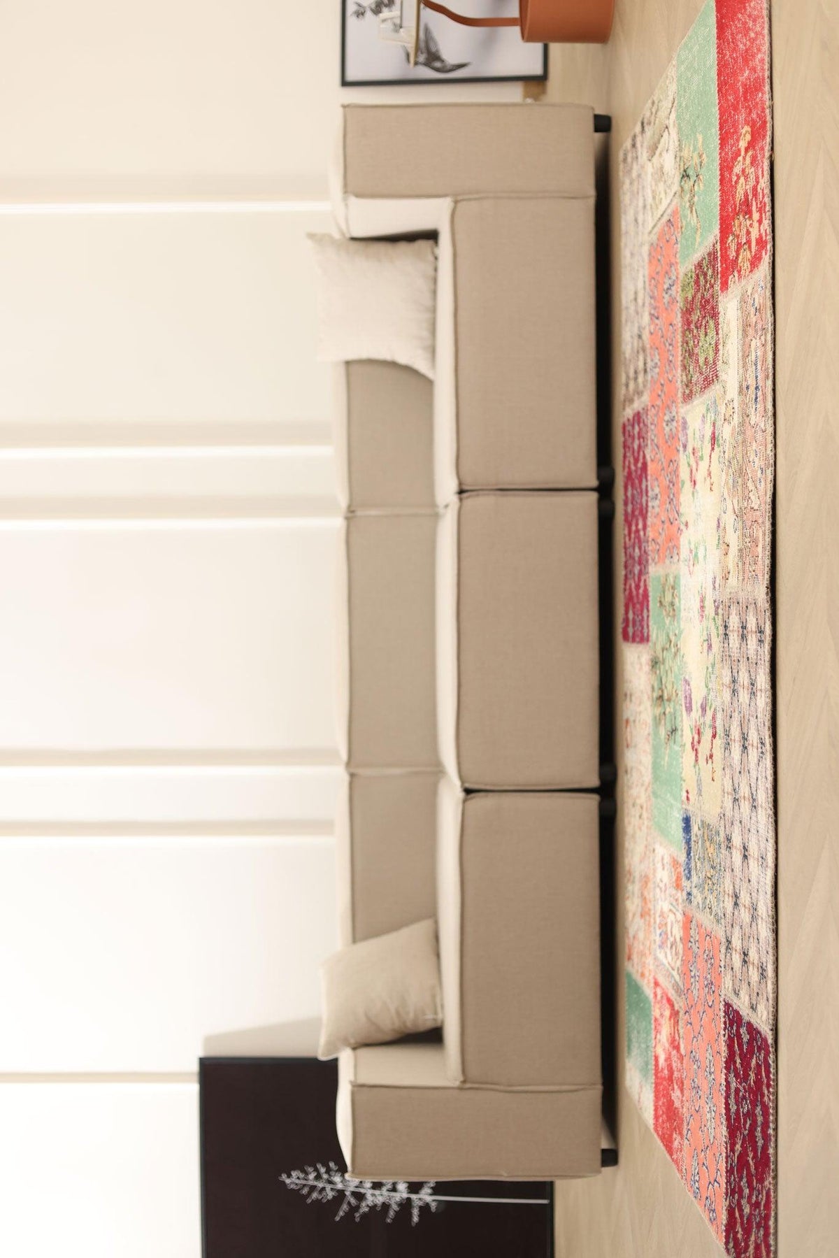 Handmade 5x7 ft vintage Turkish patchwork area rug featuring vibrant floral patterns in wool and cotton, styled in a living room.