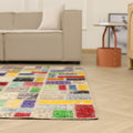 6.5x6.5 ft handmade patchwork Turkish rug with vibrant geometric wool and cotton squares in a modern living room.