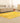 5x7 ft yellow patchwork Turkish area rug in wool and cotton with vintage overdyed patterns in a bohemian living room.