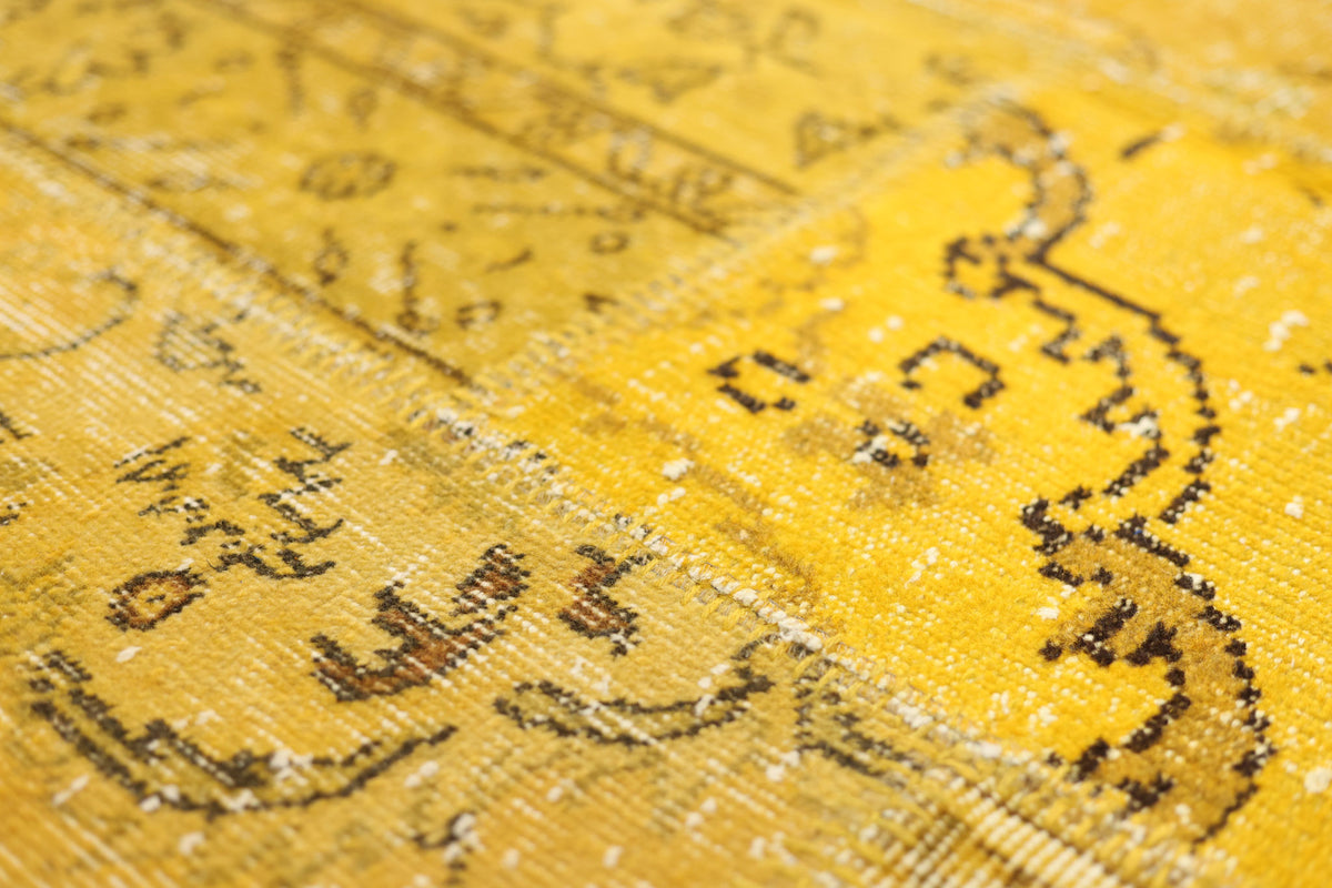 Yellow vintage Turkish patchwork rug with overdyed wool and cotton patterns in a 5x7 bohemian style.