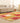 6x7 ft vintage Turkish patchwork area rug in vibrant yellow and red wool-cotton blend with bohemian overdyed patterns.