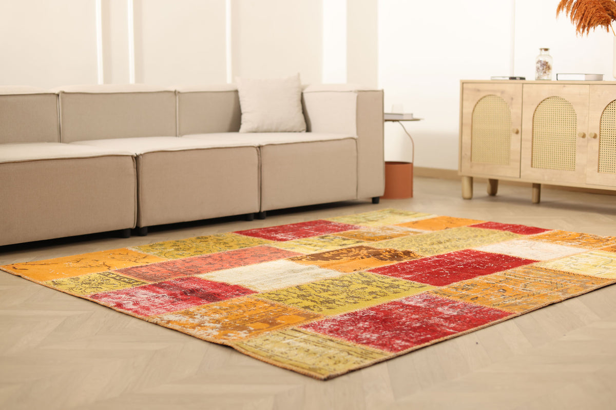 6x7 ft vintage Turkish patchwork area rug in vibrant yellow and red wool-cotton blend with bohemian overdyed patterns.