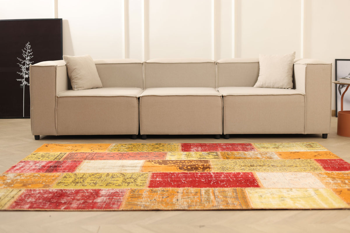 6x7 ft handmade Turkish patchwork rug in vibrant yellow and red wool and cotton, featuring a bohemian overdyed design.