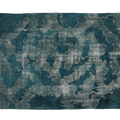 Blue and gray patterned rug on a white background