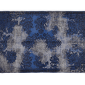 Blue and gray patterned rug on a white background