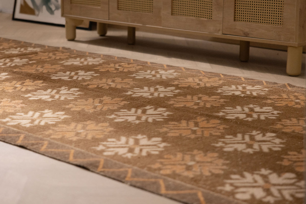 Handwoven vintage Kars runner rug in brown and beige with geometric patterns, crafted from wool and cotton.