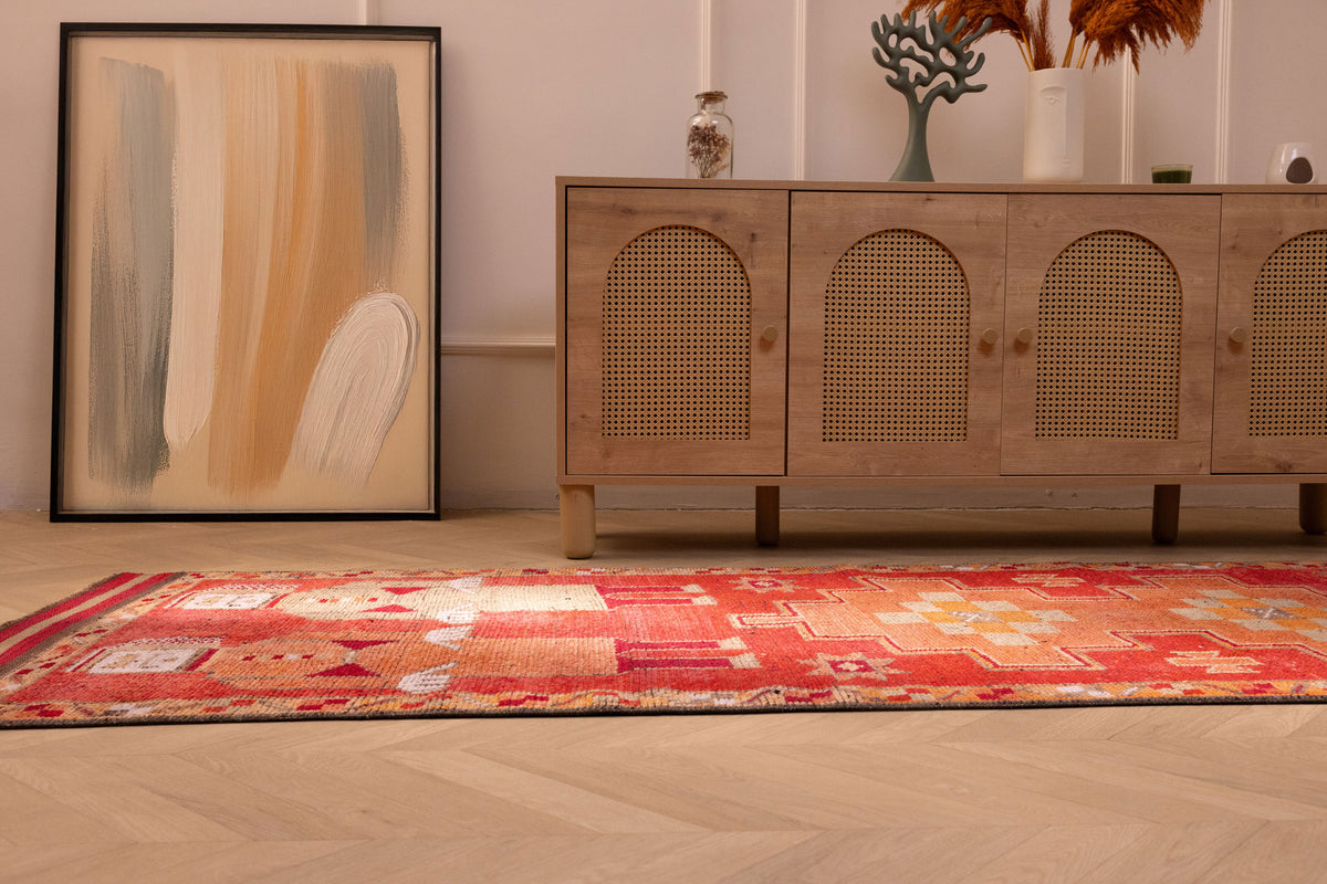 Handmade 3.3x11.5 ft Persian style runner rug in red and orange wool-cotton blend with traditional human figure patterns.