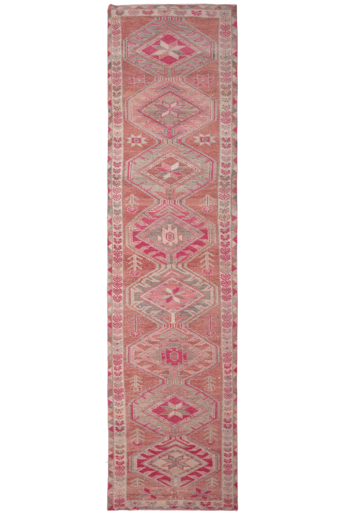 Handmade 2.7x12.6 ft wool and cotton runner rug in brown and pink with a bohemian floral Persian-style pattern.