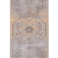 Vintage 2.7x5.9 ft Turkish runner rug in beige and brown with distressed geometric patterns and wool-cotton blend.
